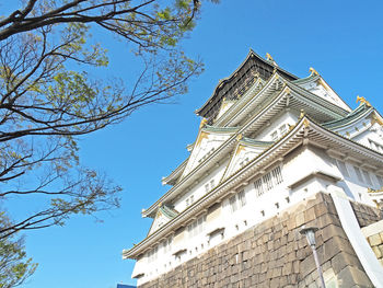 Low angle view of building against blue sky