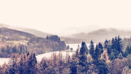 Scenic view of snow covered mountains against sky