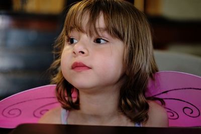 Close-up of girl with wings