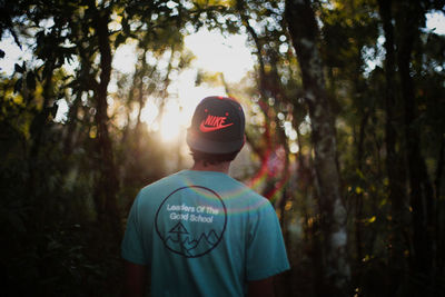 Rear view of man in forest