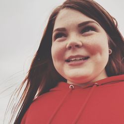 Close-up portrait of a smiling young woman