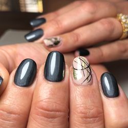 Cropped hands of woman showing nail art