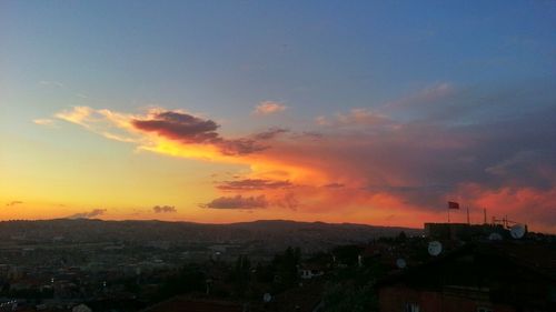 Aerial view of townscape against sky during sunset