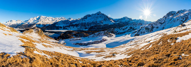 View of the village of grevasalvas, and lake sils, in engadine, switzerland, in winter.