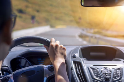 Man driving car on road