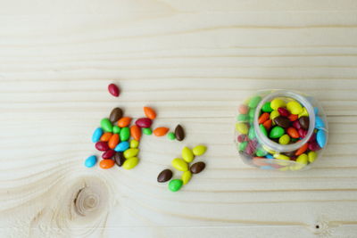 High angle view of multi colored candies on table