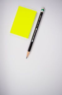 High angle view of pen on paper against white background