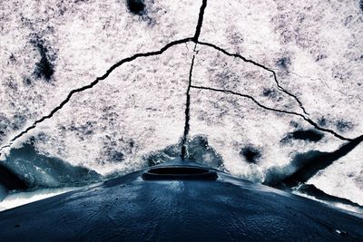 High angle view of snow covered car on road