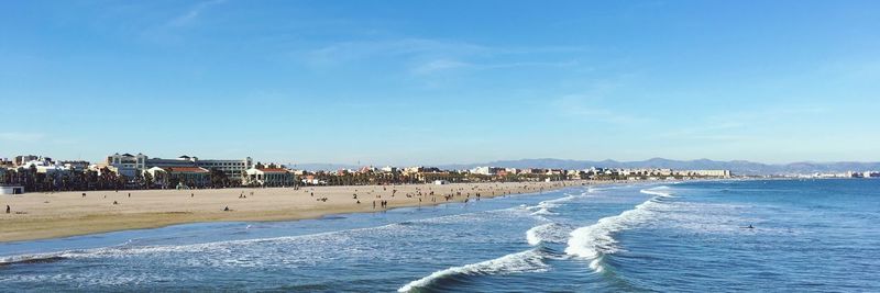 Scenic view of beach against sky in city