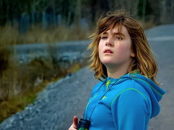 Close-up of boy against water