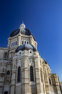 Low angle view of a building against blue sky