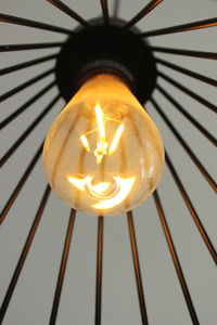 Close-up of illuminated light bulb