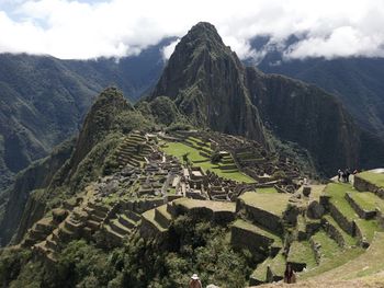 Panoramic view of ruins of mountain against cloudy sky