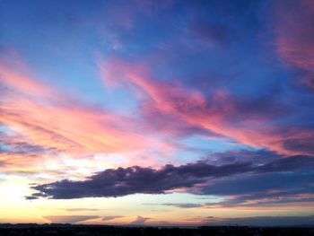 Low angle view of dramatic sky during sunset