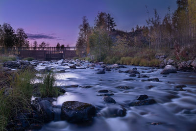 Scenic view of river against sky during sunset