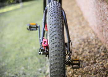 Close-up of bicycle parked on field