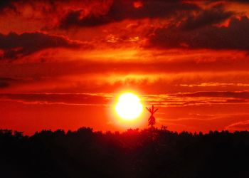 Scenic view of dramatic sky during sunset