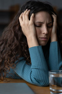 Stressed worried female employee feeling anxious about deadline at workplace. work anxiety concept