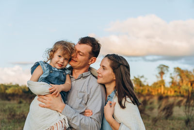 Young couple with cute two-years-old girl