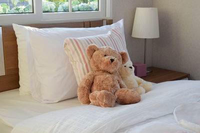 Teddy bears on bed at home