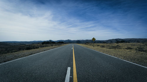 Surface level of empty road against sky