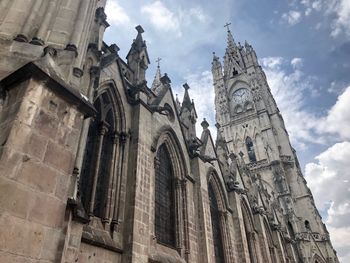 Low angle view of bell tower against sky