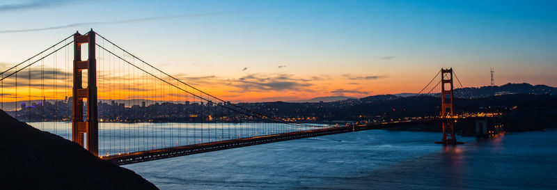 View of suspension bridge at sunset