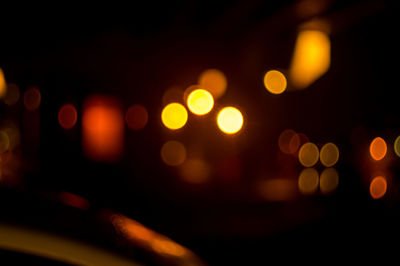 Defocused image of illuminated lights at night
