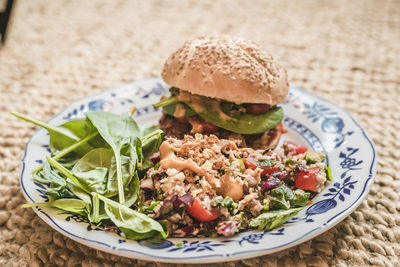 Close-up of burger in plate on table