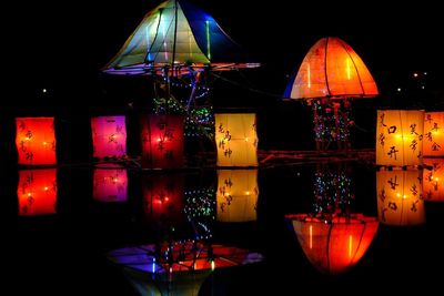 Illuminated lanterns hanging at night