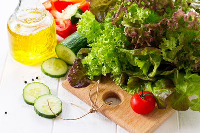 Ingredients cooking for summer salad on a white kitchen table. the concept of nutrition health.