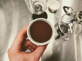 Close-up of hand holding coffee