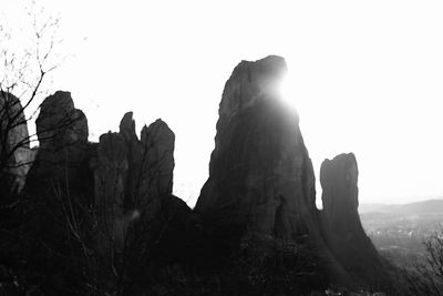 Low angle view of rocks against clear sky