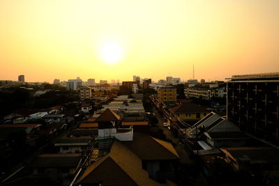 High angle view of buildings against sky during sunset