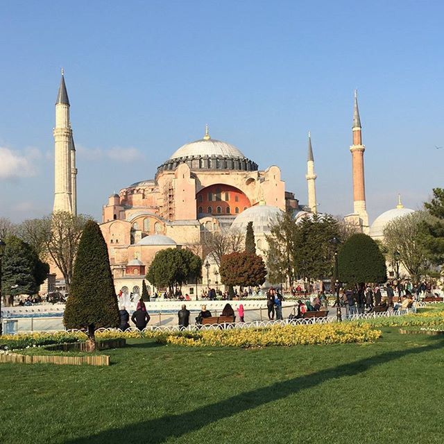 architecture, grass, built structure, building exterior, famous place, dome, travel destinations, tourism, lawn, international landmark, travel, clear sky, tourist, religion, blue, place of worship, large group of people, tree