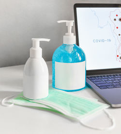 Close-up of wine bottles on table