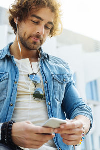 Young man using mobile phone