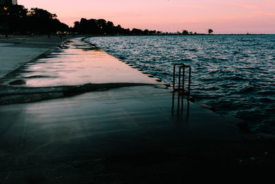 Scenic view of river at sunset