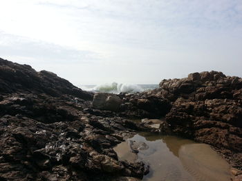 Scenic view of rocks on beach