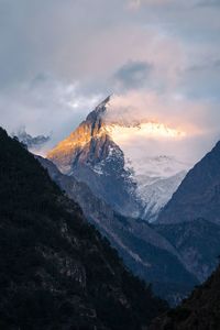 Scenic view of mountains against sky during sunset