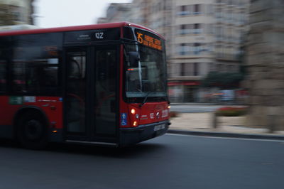 Red vintage car on city street
