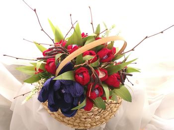 Close-up of red roses in basket