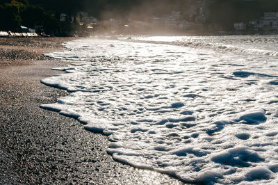 Scenic view of snow covered land