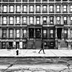 Man in front of building