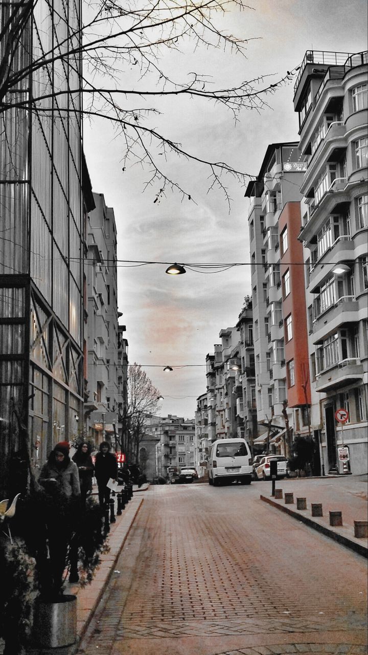 building exterior, architecture, built structure, city, street, men, walking, sky, person, city life, the way forward, building, residential structure, large group of people, residential building, lifestyles, road, transportation, incidental people