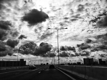 View of road against cloudy sky