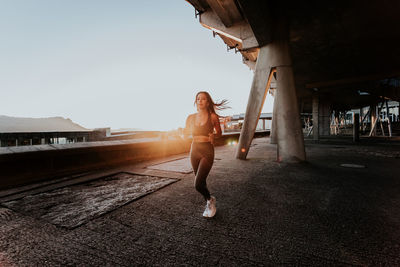 Full length of woman jogging outdoors