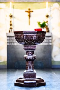 Close-up of fountain on table at temple