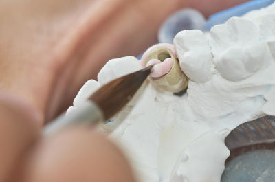 Close-up of hand holding ice cream