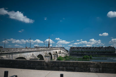 View of bridge against cloudy sky